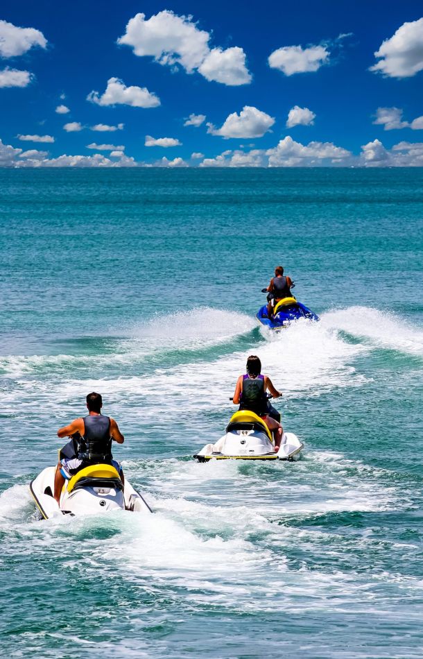 People on personal watercraft